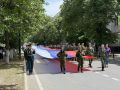 В День славянской письменности и культуры представители молодежных организаций республики пронесли по центру Черкесска огромный триколор